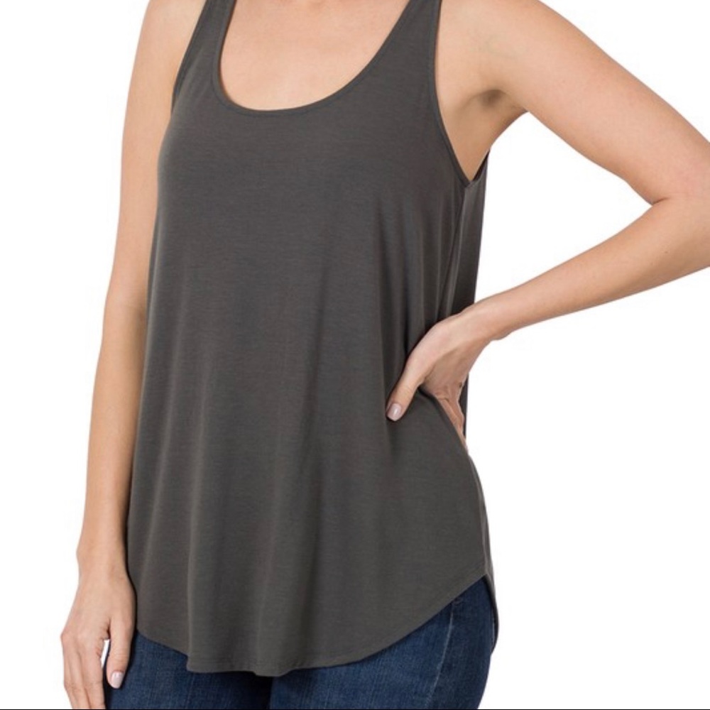 Loose fit tank. True to size, soft and longer length.